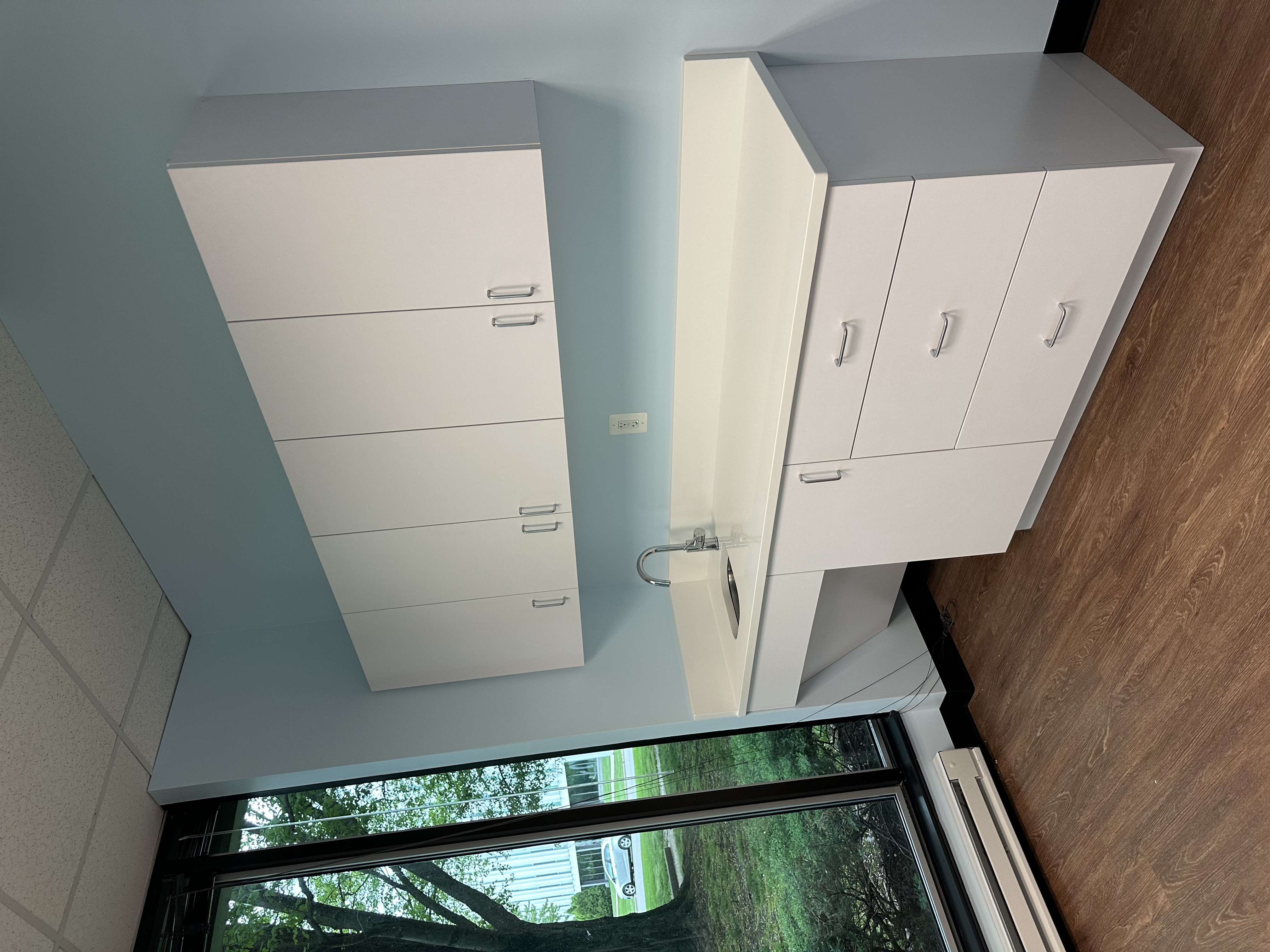 White kitchen with wooden floor